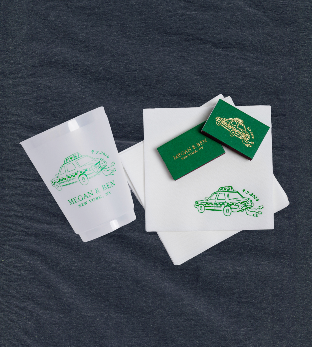 White napkins with green car design and text on a dark textured background