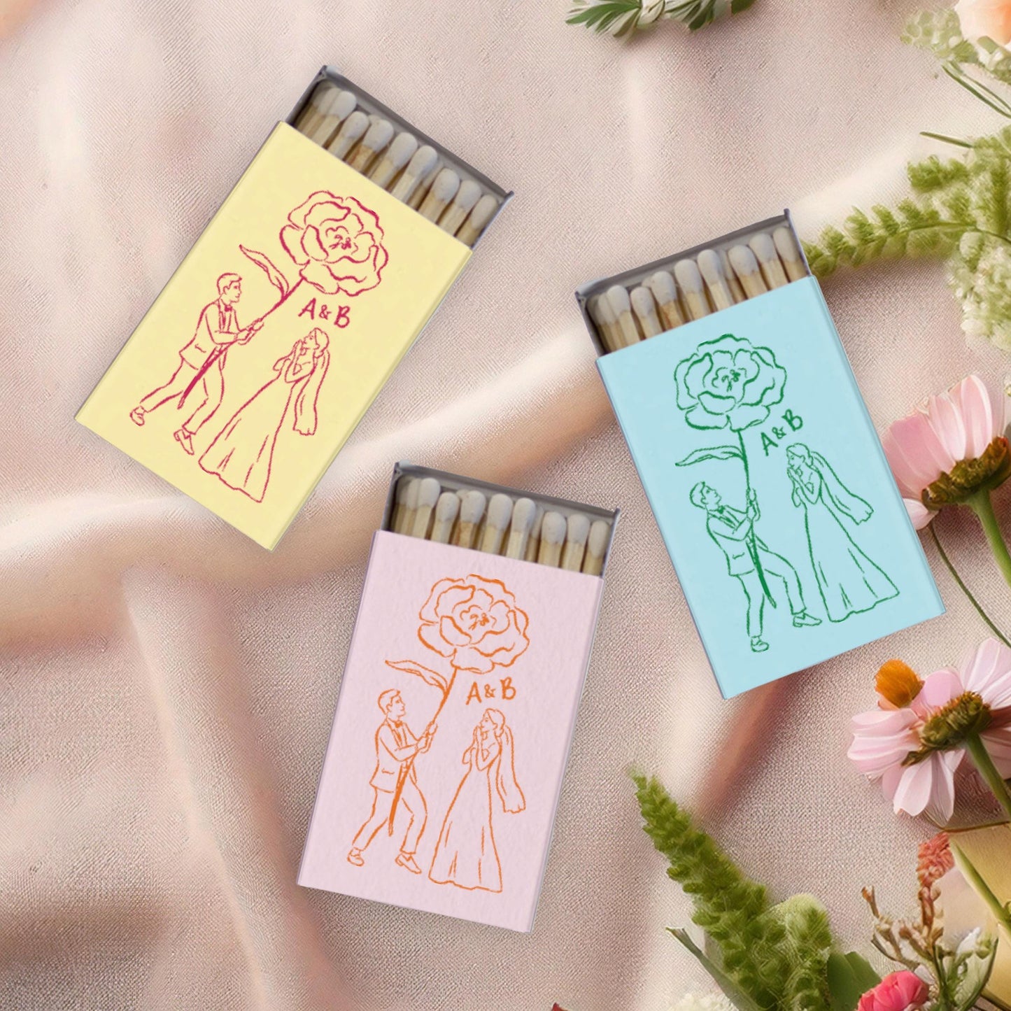 Couple with Giant Flower Matchboxes: Personalized Whimsical Wedding Favors